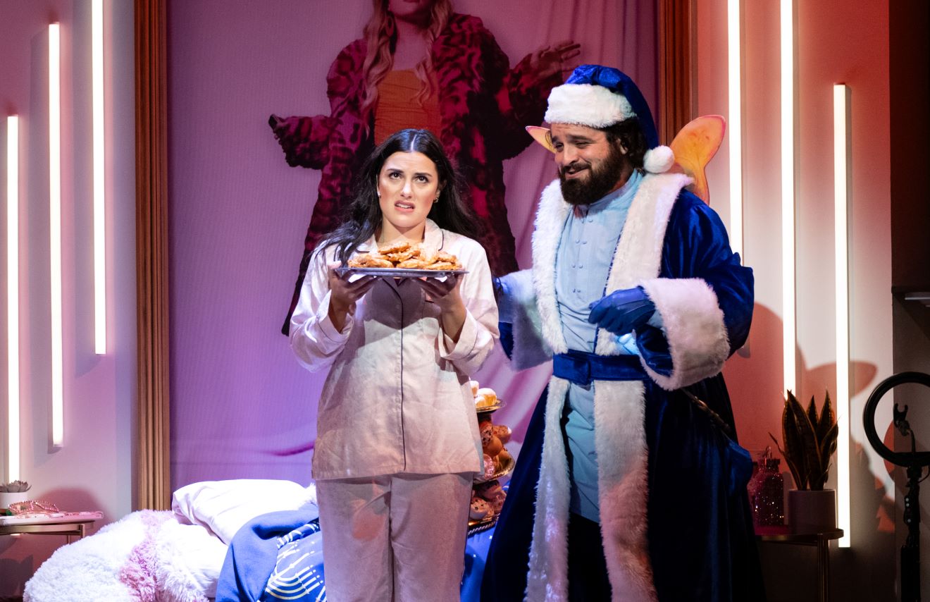 <p>Samantha Sayah (Chava Kanipshin) and Jordan Friend (Hanukkah Present) in <em>A Hanukkah Carol, or GELT TRIP! The Musical. </em>Photo by Margot Schulman.</p>