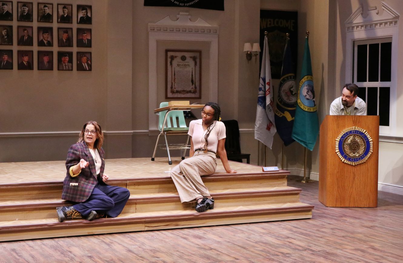 <p><span style="font-size: 12.0pt; line-height: 115%; font-family: 'Aptos',sans-serif; mso-ascii-theme-font: minor-latin; mso-fareast-font-family: Aptos; mso-fareast-theme-font: minor-latin; mso-hansi-theme-font: minor-latin; mso-bidi-font-family: 'Times New Roman'; mso-bidi-theme-font: minor-bidi; mso-ansi-language: EN-US; mso-fareast-language: EN-US; mso-bidi-language: AR-SA;">Kimberly Gilbert (Heidi), Fadekemi Laniyonu (Debater), and Michael Glenn (Mike) in <em>What the Constitution Means to Me. </em>Photo by Kent Kondo.</span></p>